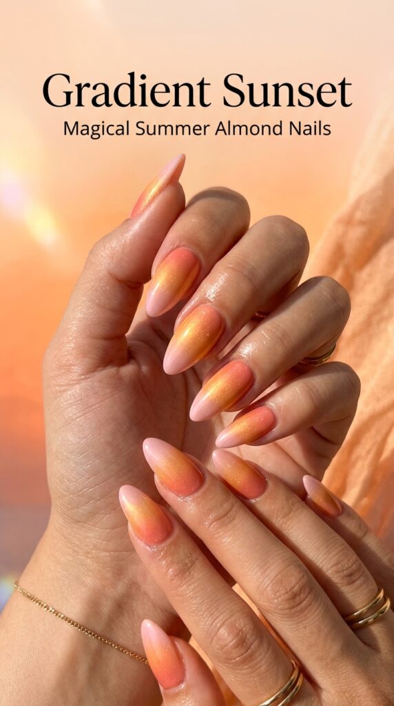 Almond nails with stunning gradient sunset design transitioning from peachy-coral through orange to blush pink for magical summer nail art






