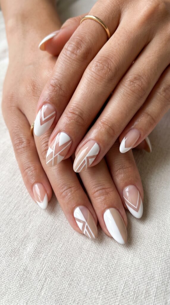 Hands with negative space geometric nail design featuring strategic bare nail areas forming triangles and angular shapes alongside precise polish application for sophisticated minimalist summer manicure






