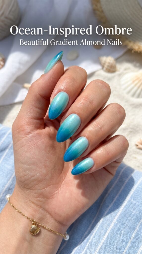 Almond nails with stunning ocean-inspired ombre gradient transitioning from turquoise to deep blue for elegant summer nail art






