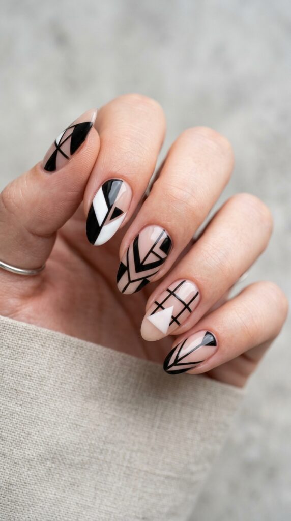 Geometric negative space nails with clean shapes and modern design, creating a bold, minimalist, and stylish manicure with a contemporary aesthetic