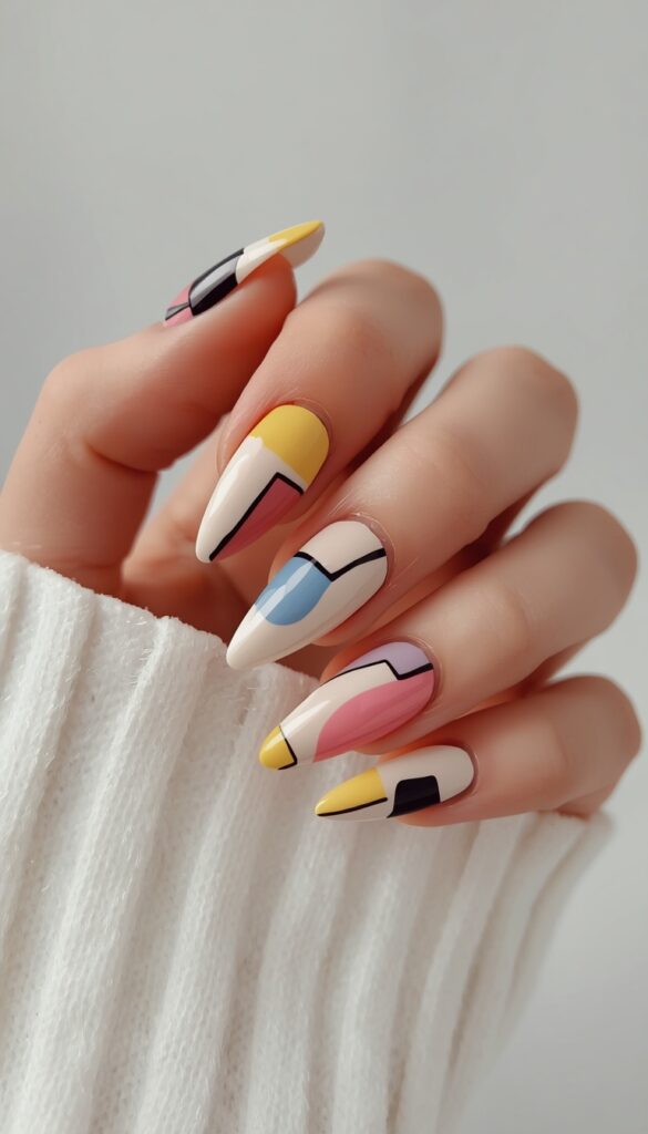 Color block abstract nails with bold shapes and contrasting tones, creating a modern, artistic, and eye-catching manicure with a trendy aesthetic
